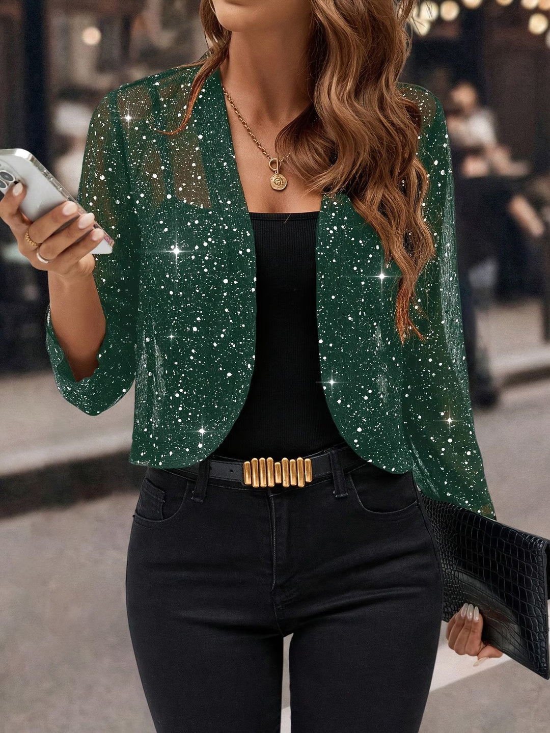 Chic women's sequin jacket, a dazzling glitter cardigan statement piece for festive occasions.