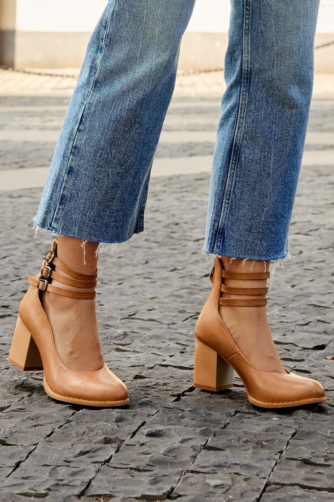 Versatile women's formal shoes featuring a sturdy block heel and adjustable ankle strap design.