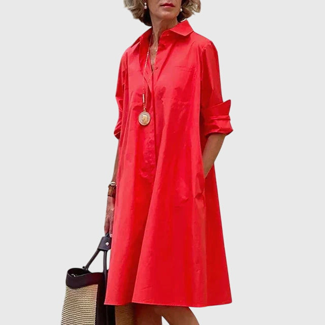 Close-up on the pockets of a comfortable long sleeve women's dress, highlighting versatile design.