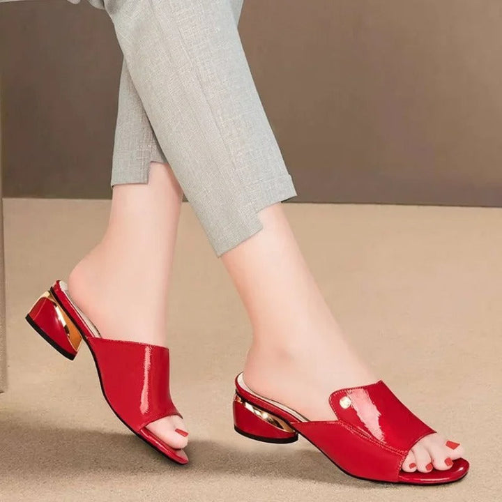 Versatile glossy women's slides; elegant open-toe design provides comfort for any summer occasion.