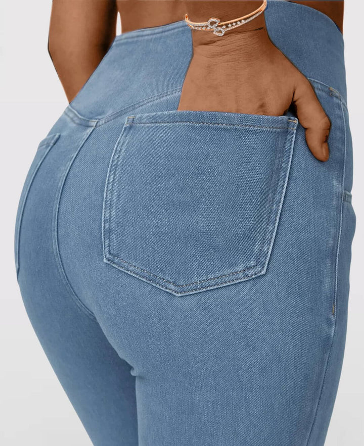 Slim fit dark blue high-waist stretch jeans for women, a versatile and comfortable denim bottom.