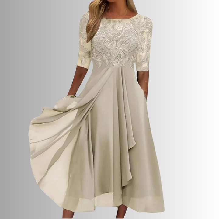 Chic women's midi dress with intricate lace top, elegant half sleeves. Flattering A-line design for fashion events.