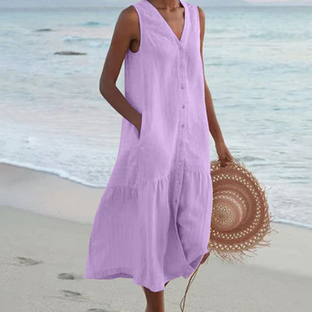 Casual women's sleeveless midi dress featuring a stylish v-neck, button front, and fashionable tiered design.