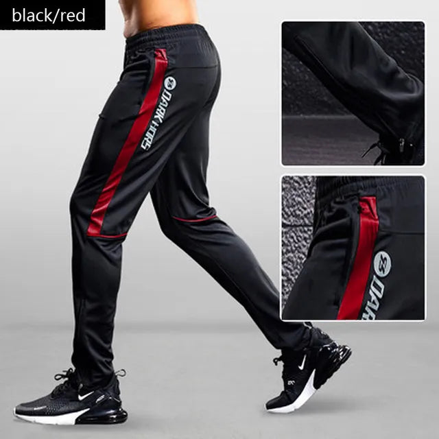 Versatile men's activewear joggers with a tapered fit, performance fabric, and convenient zipper pockets.