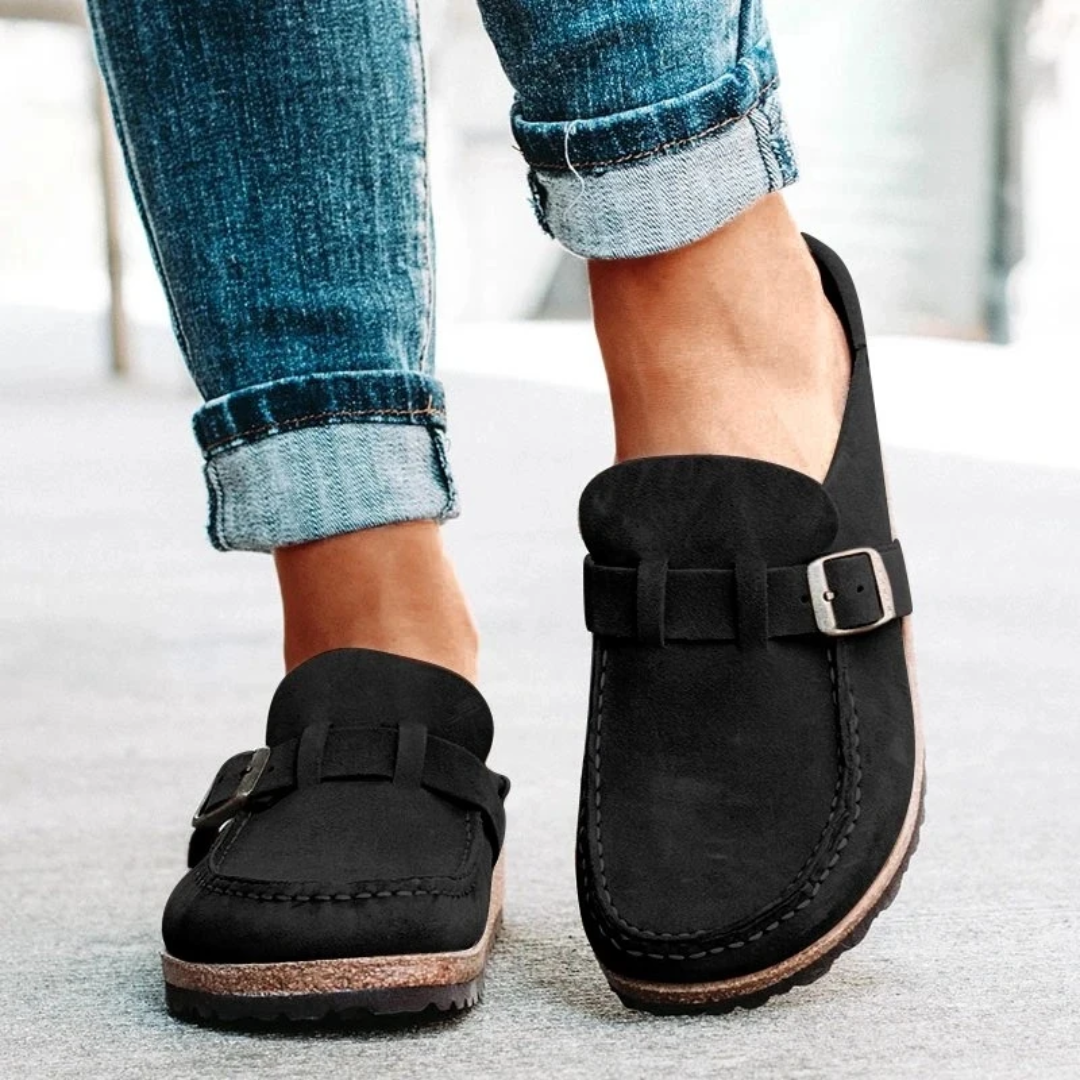 Classic black women's buckle loafers. These comfortable, stylish low heel flats are perfect for elegant casual outfits.