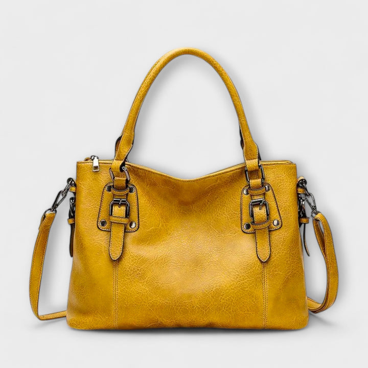 Chic women's leather shoulder bag, an elegant & durable accessory for a sophisticated look, available in multiple colors.