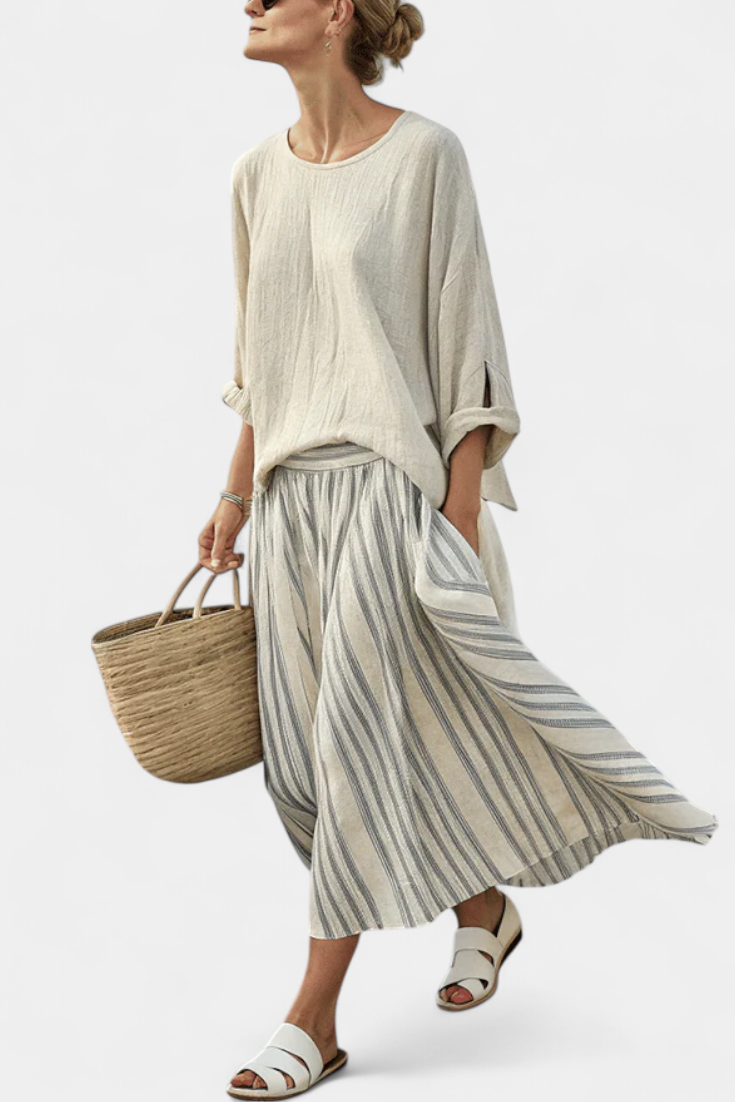 Beige loose blouse & striped midi skirt set for women. Comfortable two-piece summer casual or vacation outfit.