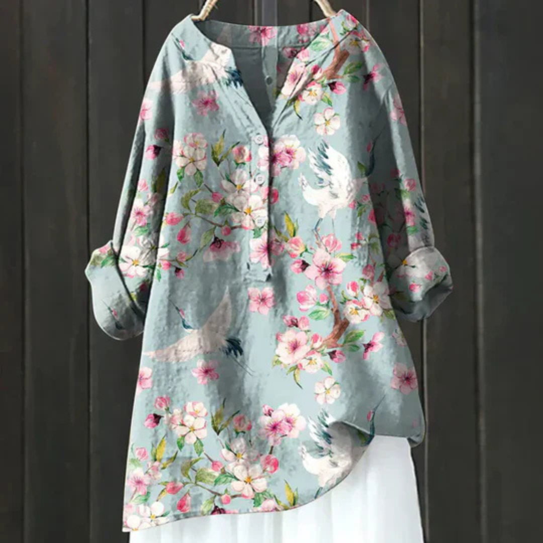 Elegant women's floral long sleeve blouse with a V-neck, perfect for spring and summer fashion.