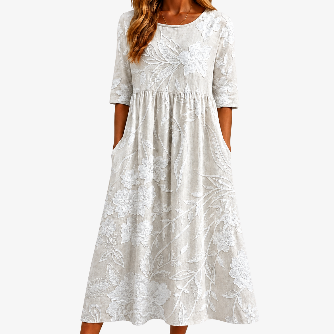 Elegant women's sage green floral midi dress with pockets. Perfect for summer casual wear, a flowy and comfortable style.