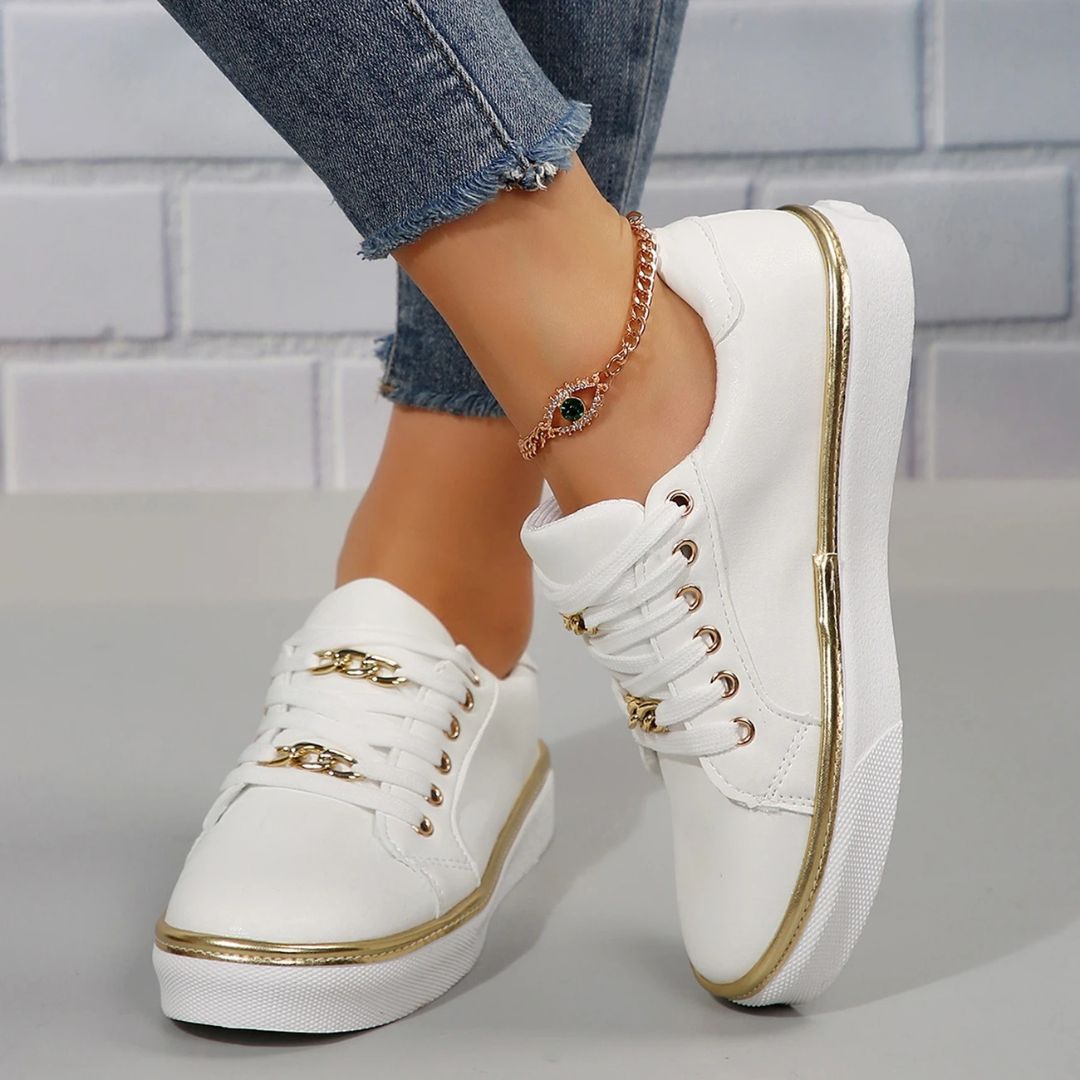 Stylish women's everyday sneakers with eye-catching gold accents & a soft, comfortable insole for active use.