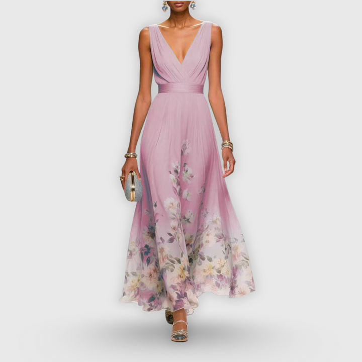 Comfortable pink floral sleeveless midi dress for women. Versatile casual summer day dress with elegant design.