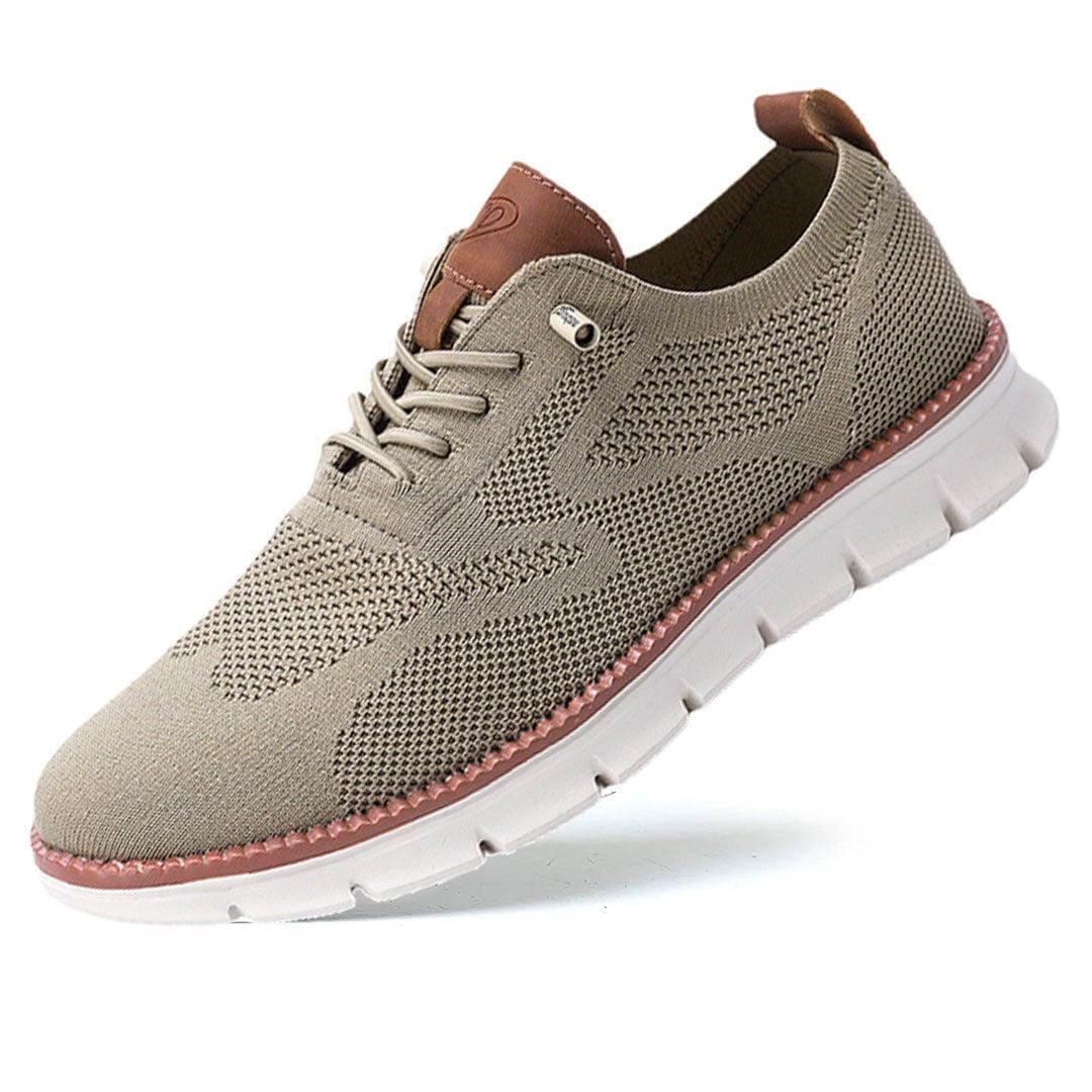 Modern men's sneakers, perforated for airflow, featuring a classic lace-up and round toe.