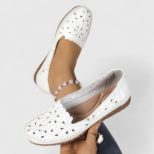 Lightweight women's slip-on flat sandals, perfect casual footwear for summer style and comfort.