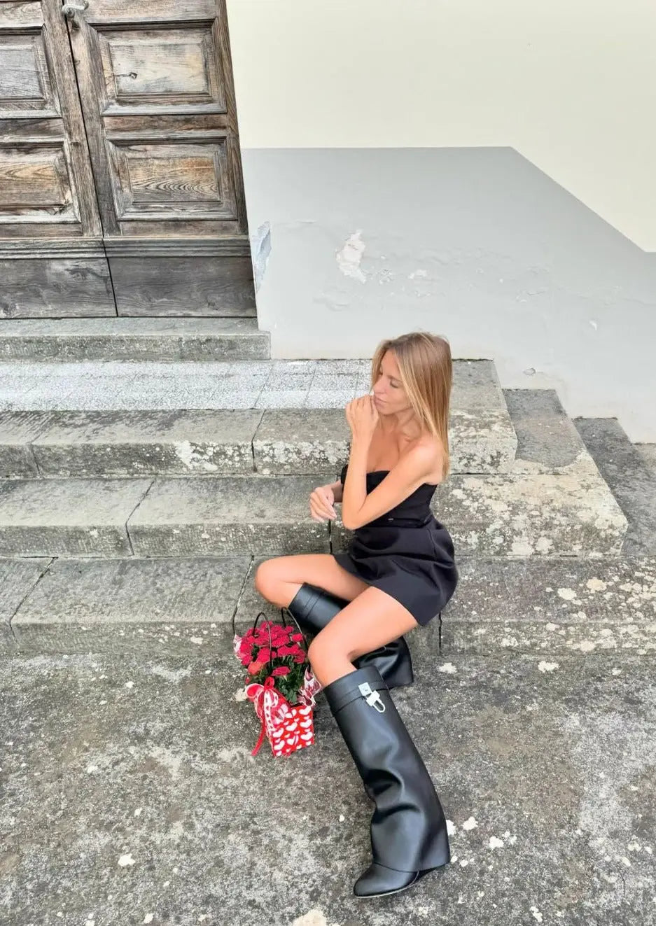 Avant-garde glossy wedge women's boots, knee-high for a modern and elegant street style.