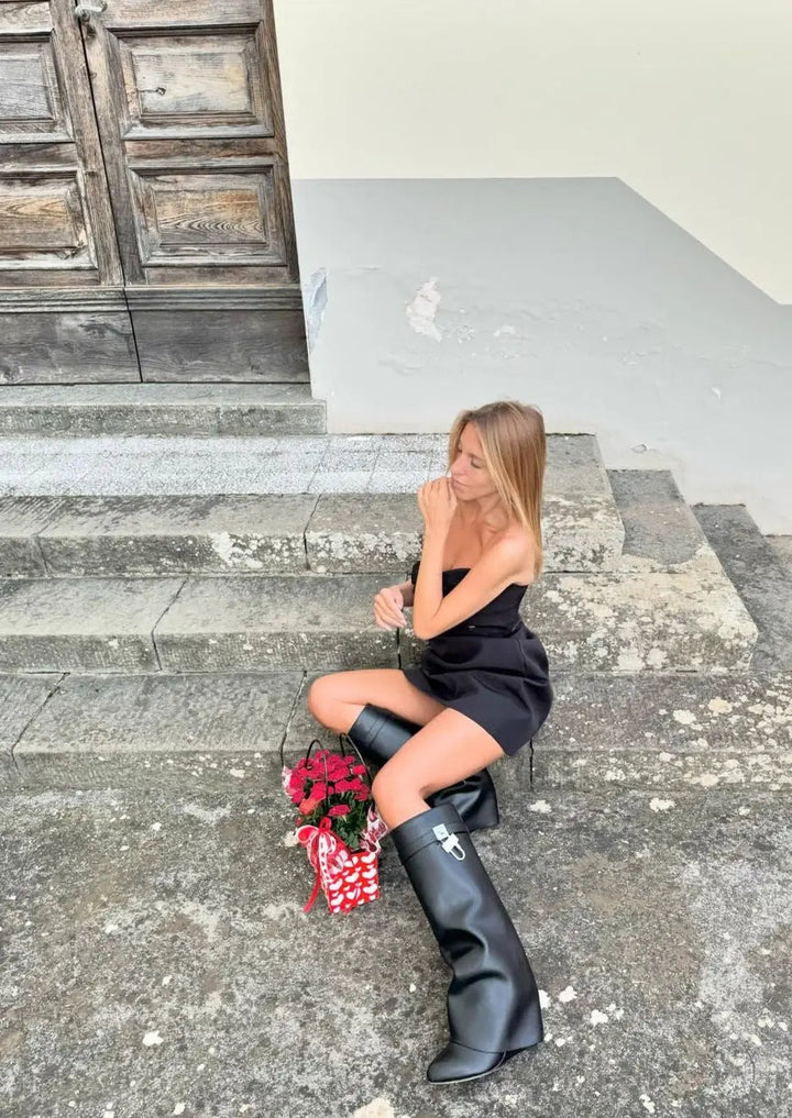 Avant-garde glossy wedge women's boots, knee-high for a modern and elegant street style.