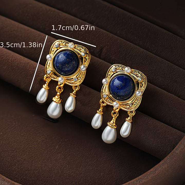 Versatile royal blue pearl chandelier earrings for women. Elegant drop design, ideal for formal or evening wear.