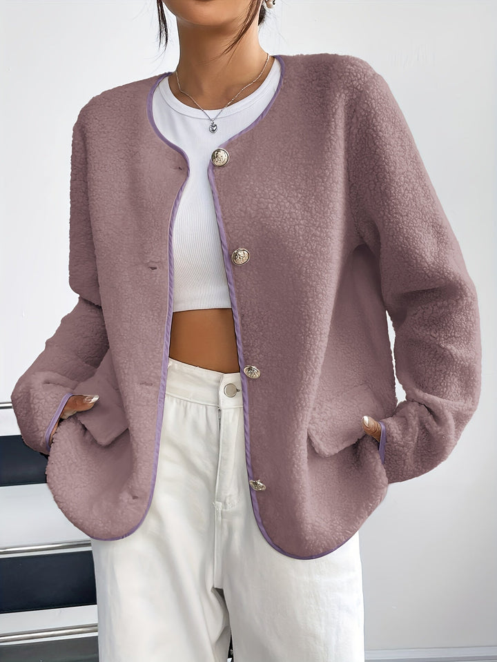 Classic button-front detail on an elegant women's jacket. Soft fabric, perfect for autumn & winter wear.