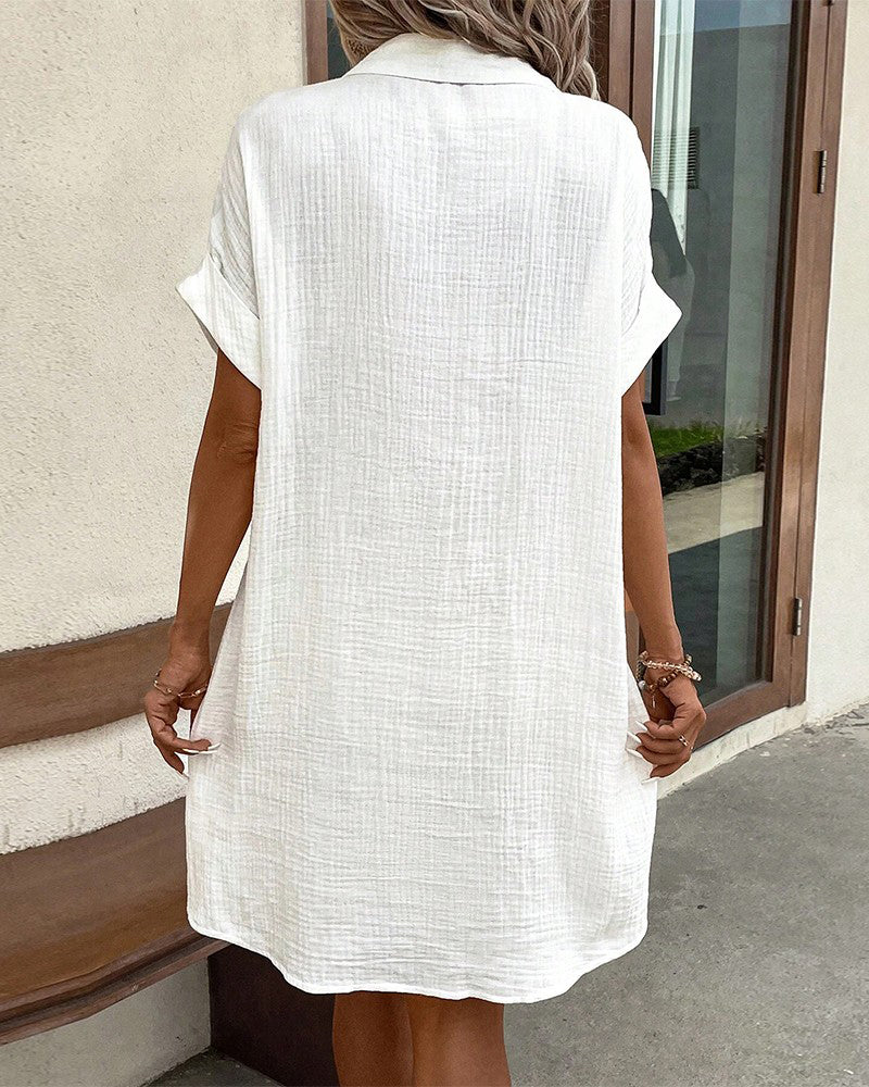 Versatile women's button-front collared mini summer dress, short sleeves, perfect for sunny casual outings.