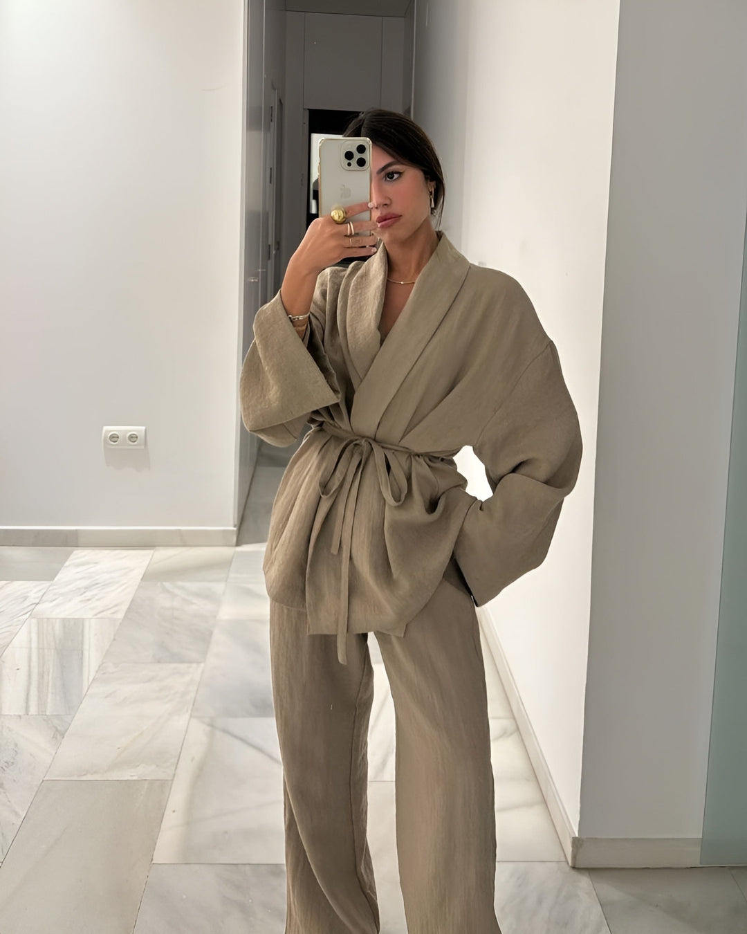 Comfortable chic women's two-piece set featuring a flowing kimono top and smart casual trousers.