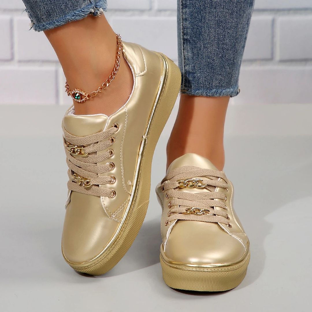 Elegant women's comfortable sneakers featuring chic gold accents & a supportive soft insole for all-day wear.