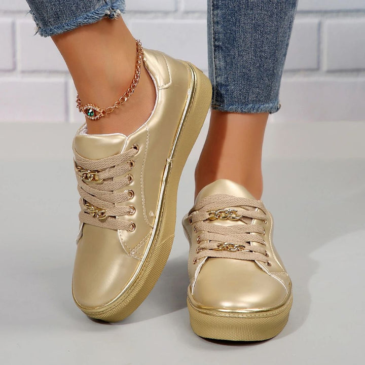 Elegant women's comfortable sneakers featuring chic gold accents & a supportive soft insole for all-day wear.