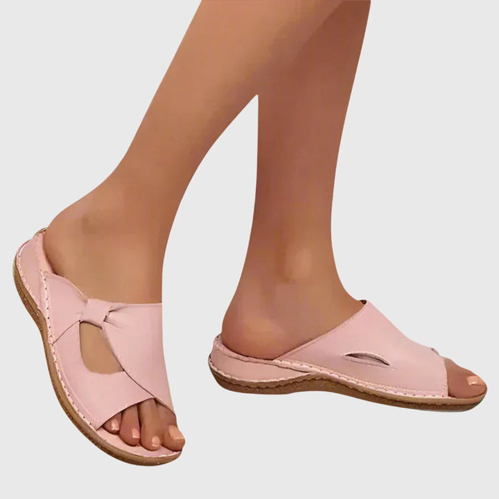 Side view of women's comfort sandals, highlighting arch support and pain relief features for daily wear.