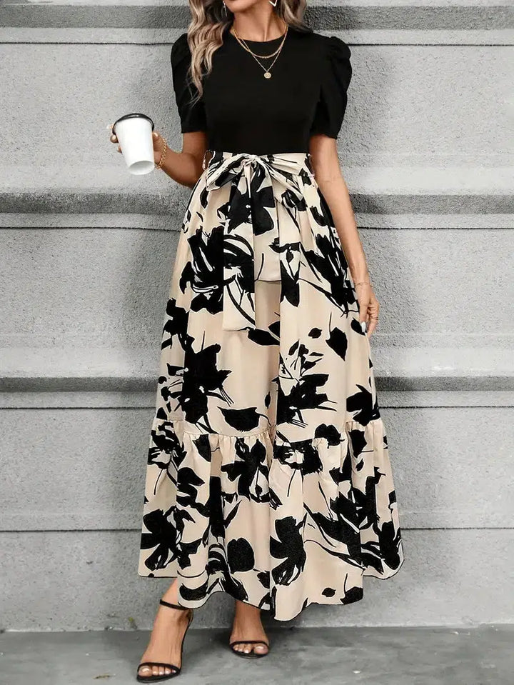 Comfortable women's flowy maxi sundress with a vibrant botanical print, great for casual summer outings.