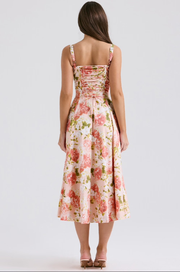 A modern elegant women's blue midi dress with a distinctive lace-up corset design. Party perfect.