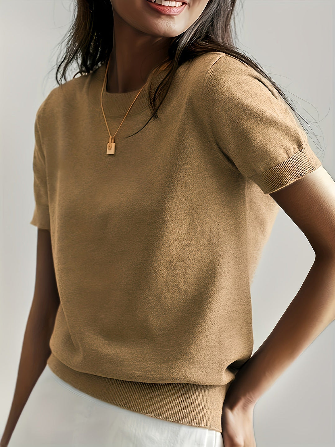 White women's versatile short sleeve knit sweater, soft comfort for elegant & casual all-season wear.