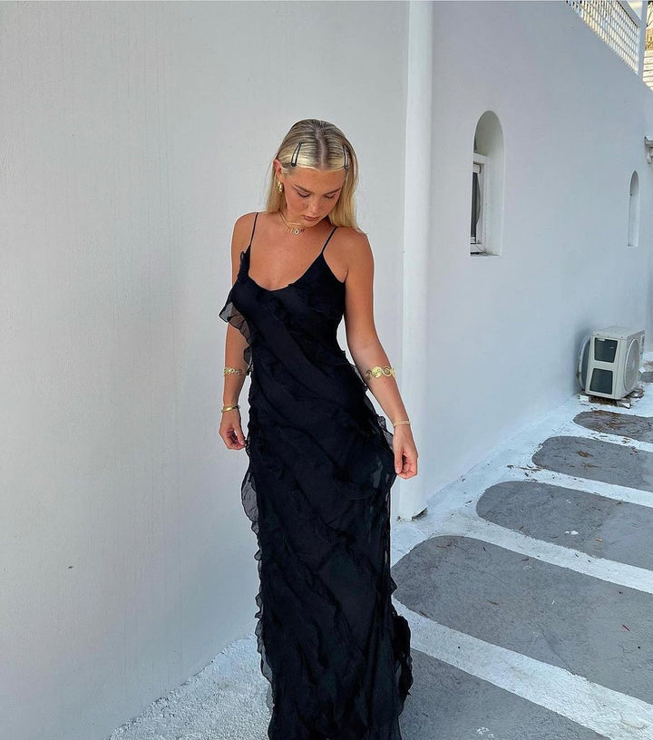 Elegant women's maxi dress with delicate ruffles, ideal for events and summer gatherings.