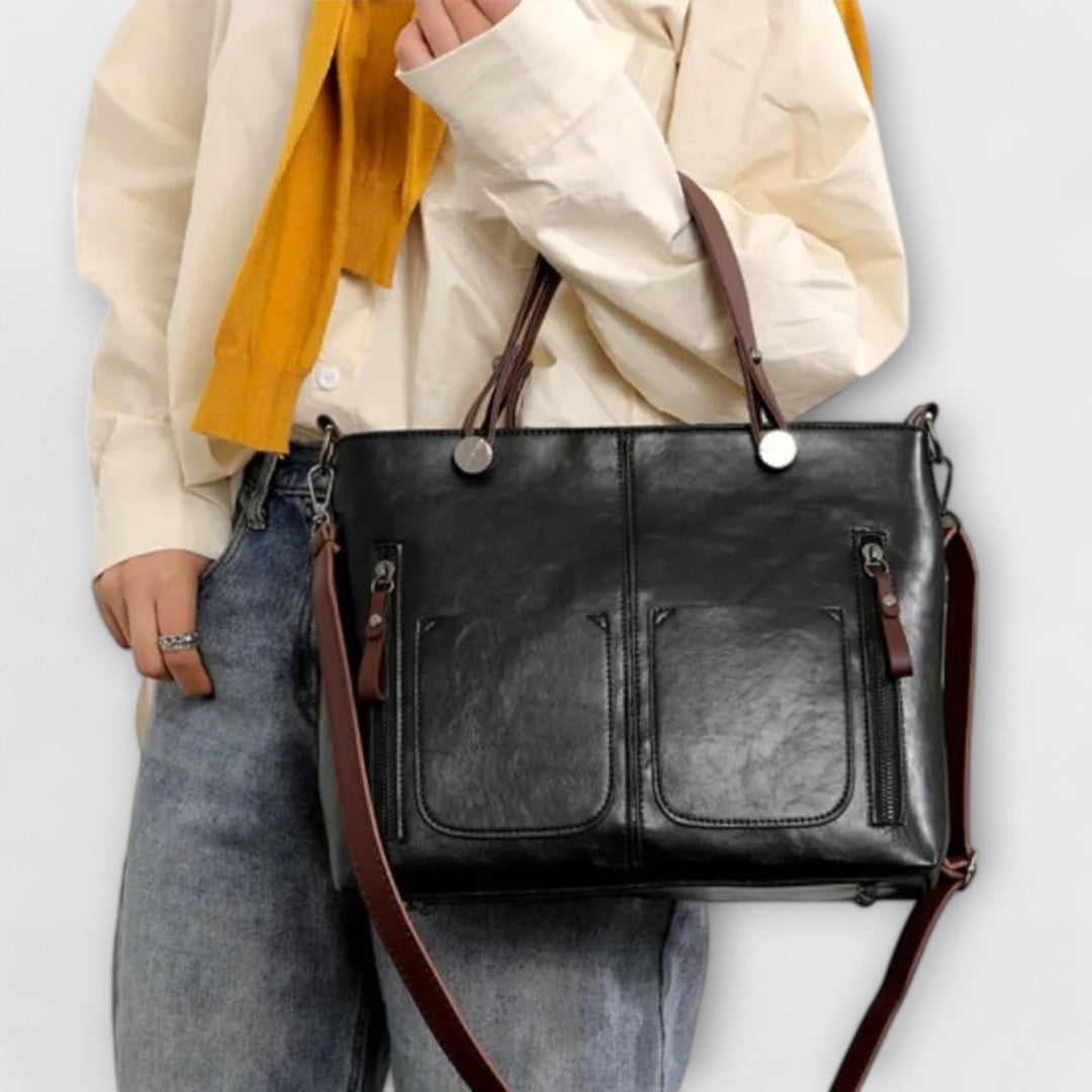 Simple & elegant women's black leather shoulder bag, a versatile classic for any outfit.
