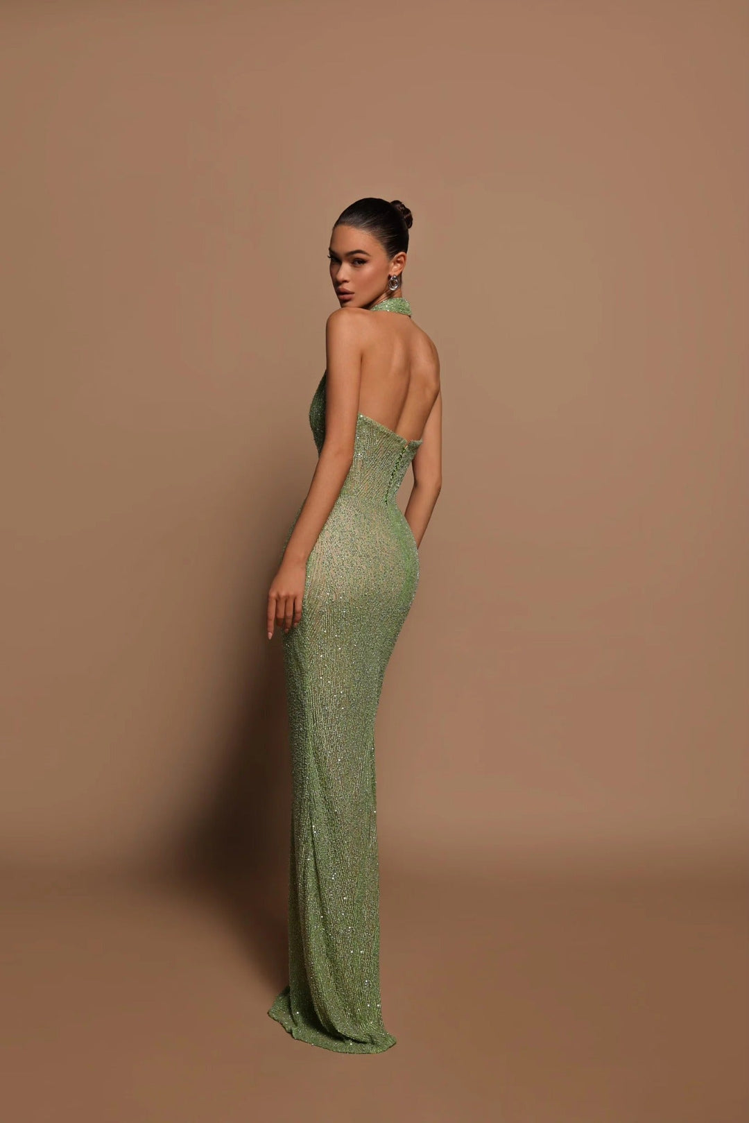 Luxurious women's sequin evening gown. This elegant long formal dress is perfect for special occasion parties.