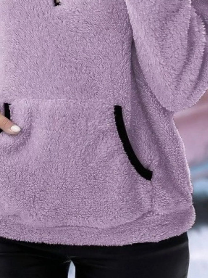 Stylish women's half-zip pullover, essential for winter fashion layering.