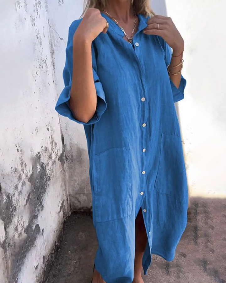 Model wearing a relaxed fit women's shirt dress, perfect as a versatile day dress or casual summer outfit.