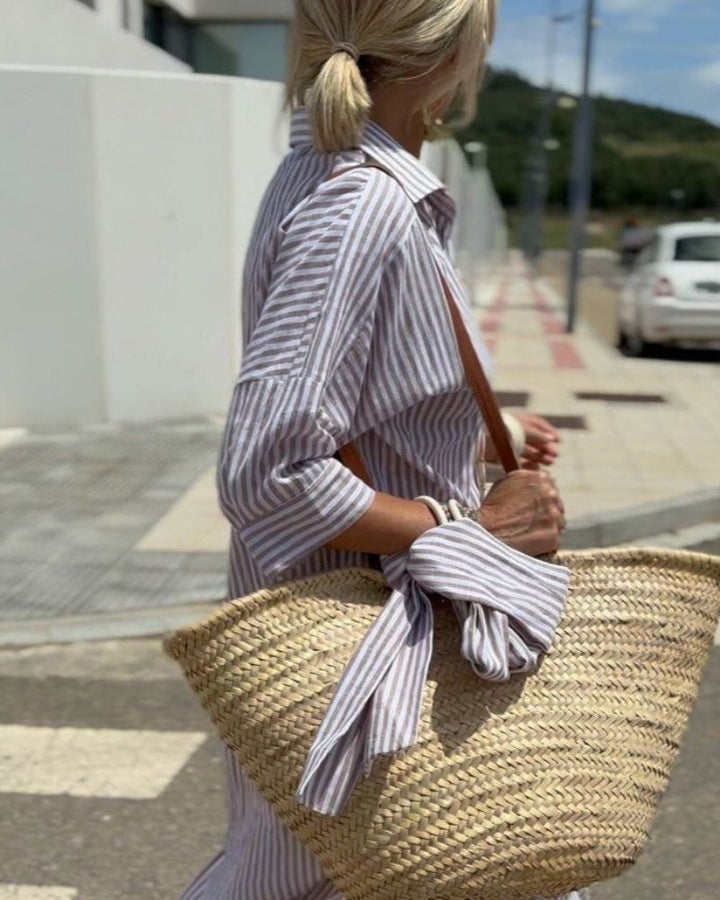 Elegant women's striped midi shirt dress. Long-sleeve, button-down, and versatile, perfect as a summer casual dress.