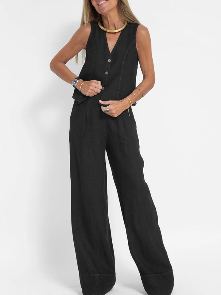 Model showcasing the full women's two-piece sleeveless V-neck and wide-leg trouser outfit.
