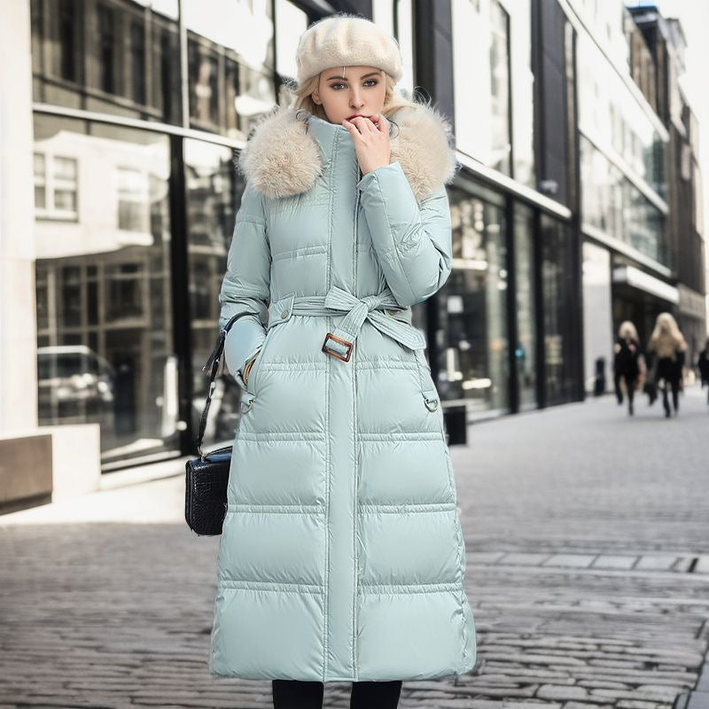 Women's elegant winter coat with a removable hood, offering warm and chic outerwear style.