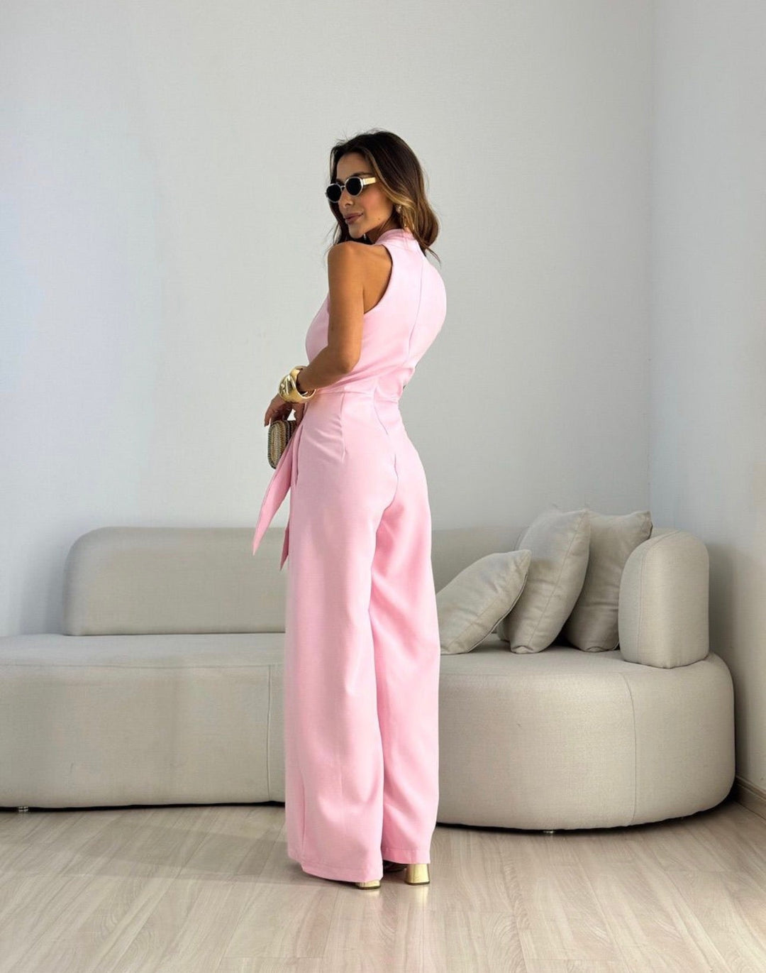 Sophisticated women's sleeveless flowing jumpsuit for formal and evening events.