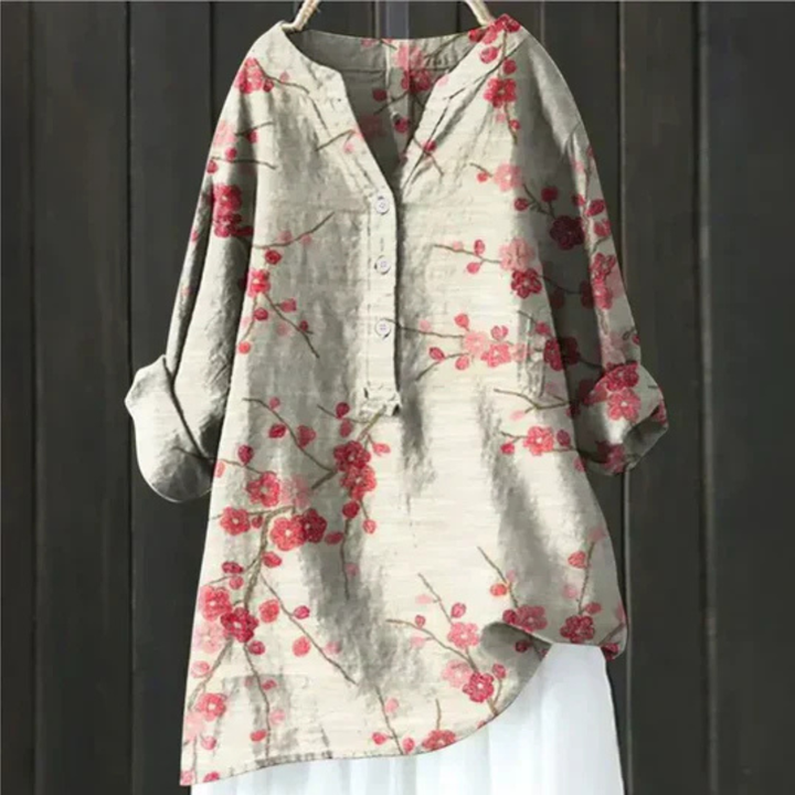 Soft women's floral long sleeve blouse with a V-neck, offering a comfortable loose fit for spring fashion.