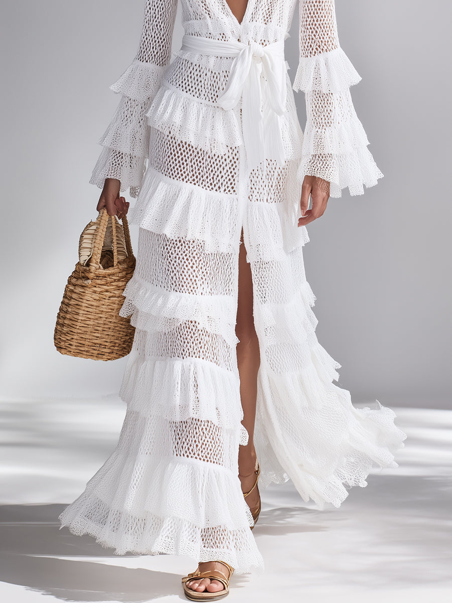 Versatile women's bright white knit cardigan. Maxi length with intricate crocheted pattern & ruffles.