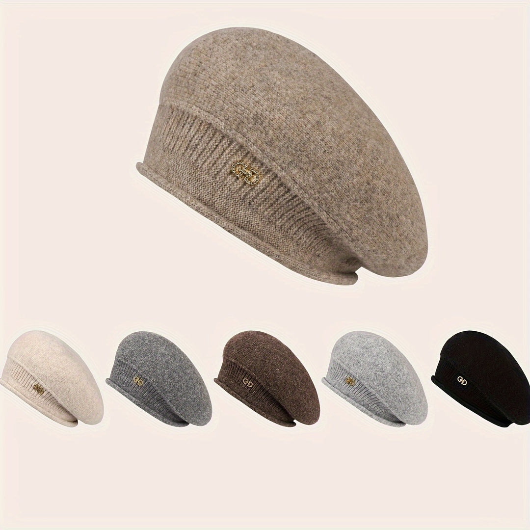 Stylish women's beret, a warm knitted hat for cold weather. Elegant and soft winter headwear.
