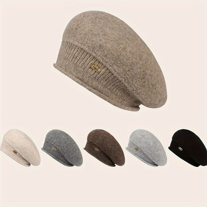 Stylish women's beret, a warm knitted hat for cold weather. Elegant and soft winter headwear.