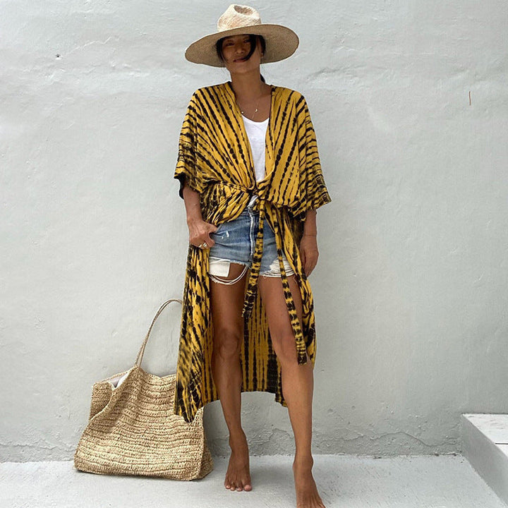 Stylish women's sun protection resort wear, glamorous beach cover up for a trendy vacation.