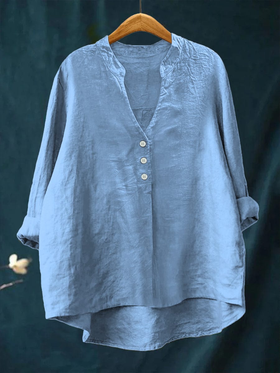 Chic women's button-front top for everyday wear. Relaxed fit blouse with a high-low hem, perfect for versatile summer style.