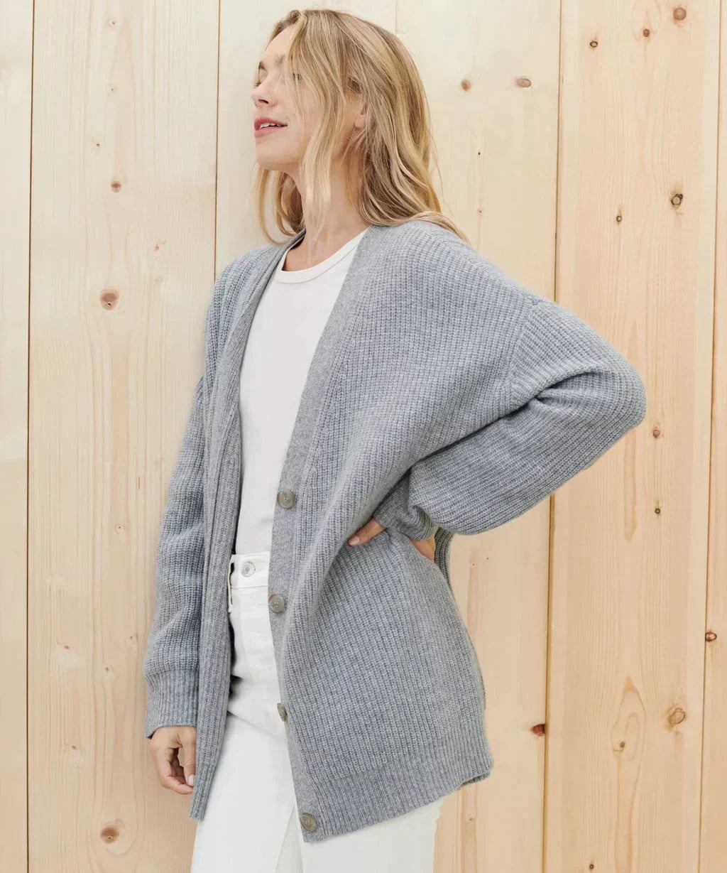 Timeless women's elegant knit cardigan, a versatile top for winter fashion and sophisticated looks.