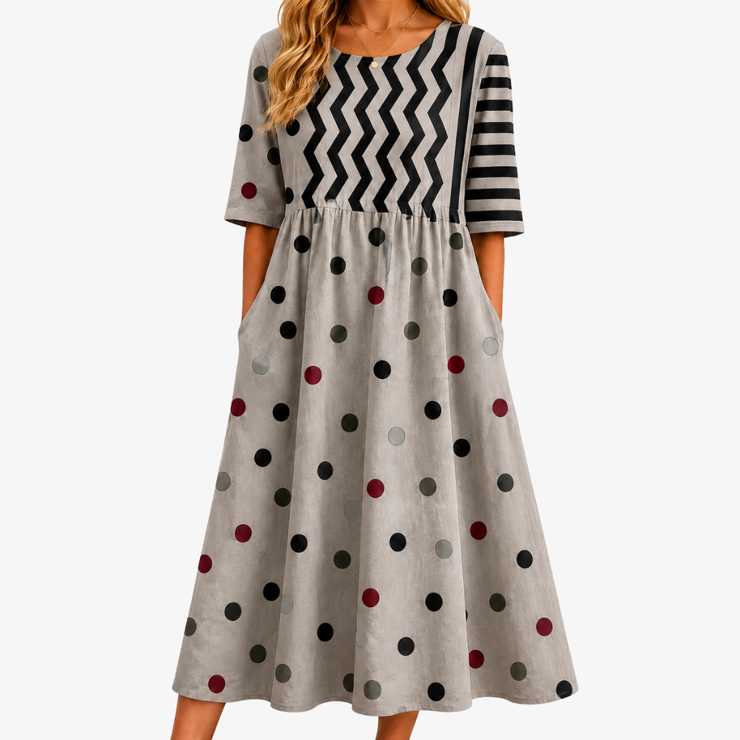 Women's Modern Charm mixed print midi dress with pockets. Flowy, elegant daywear perfect for spring/summer.