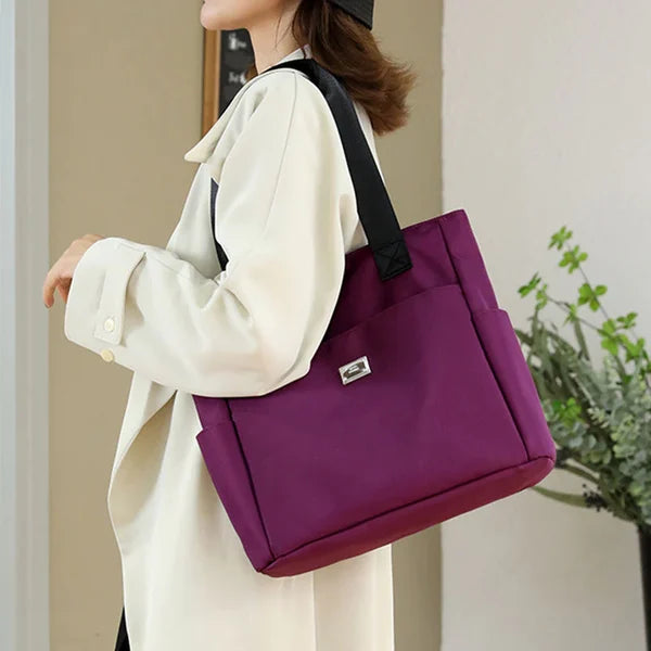 Black lightweight waterproof shoulder bag for women. Durable & stylish for daily and travel use.