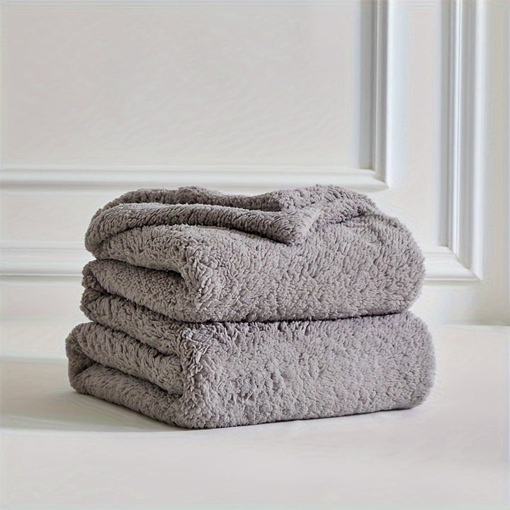 Experience ultimate comfort with this ultra soft sherpa fleece blanket, perfect for a cozy home atmosphere.
