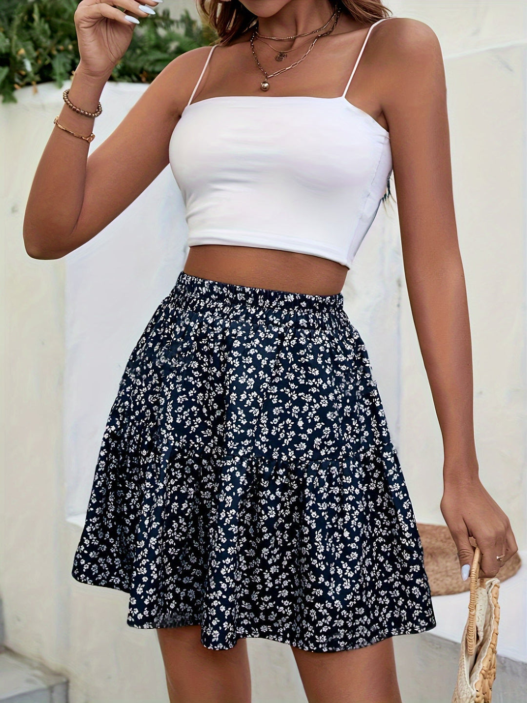 Versatile women's floral mini skirt, high waist design for elegant casual or summer fashion.