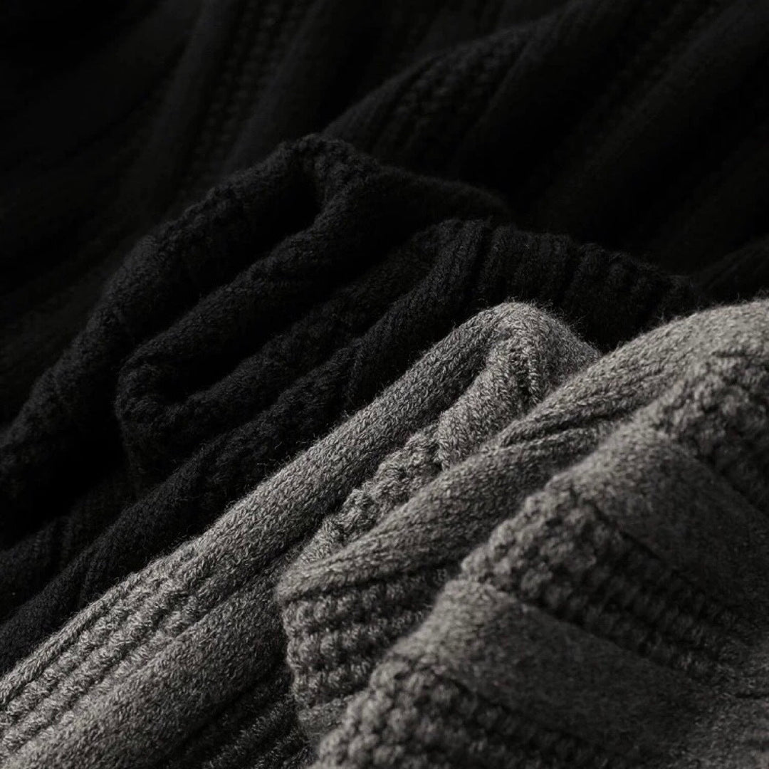 Man wearing a casual ribbed knit polo collar sweater, long sleeve, ideal for stylish everyday outfits.